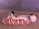 Hogtied Ashley struggling on the floor