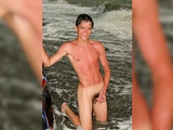Two nude teen guys have fun on the beach