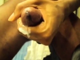 Black guy jacks off his big cock and cums hard