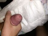 Twink cums in his wet diaper while stroking it solo